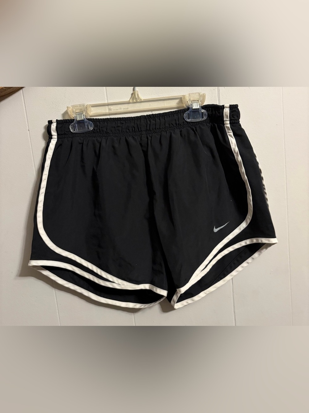 Nike Women’s Black Athletic Shorts with White Trim has tiny white speck as shown